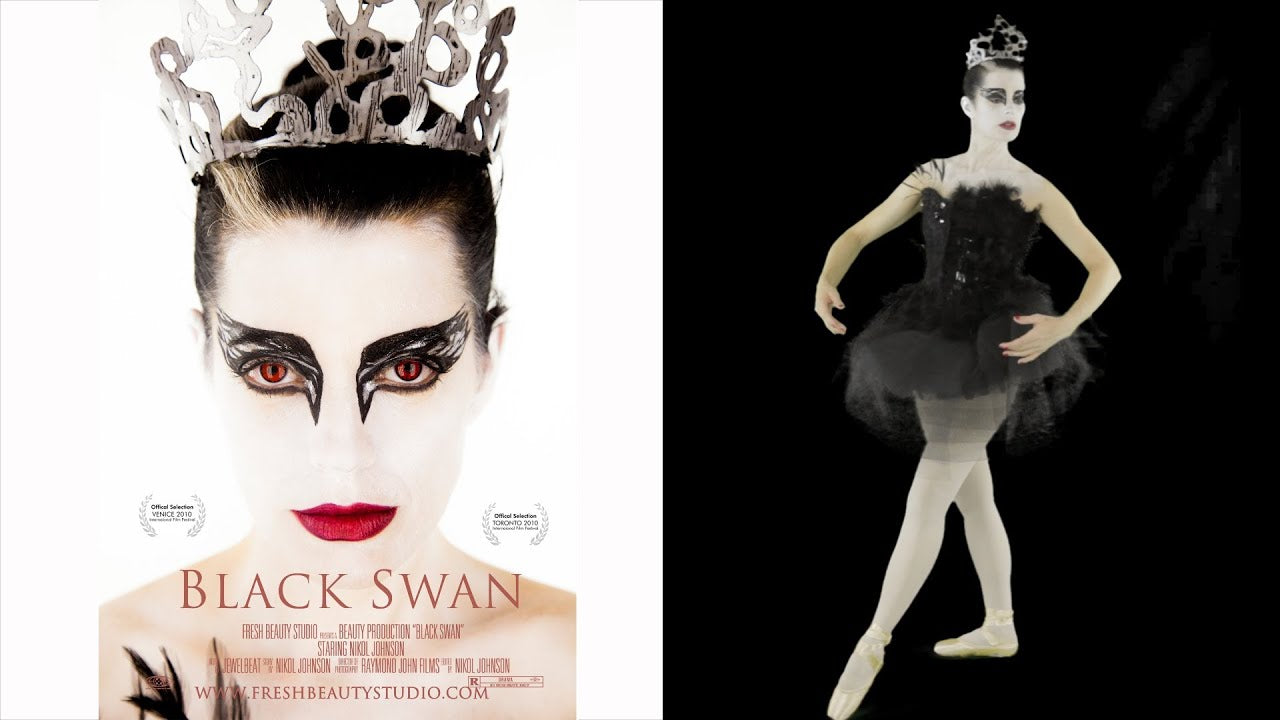 Dramatic Black Swan eye makeup with black wing and silver accents