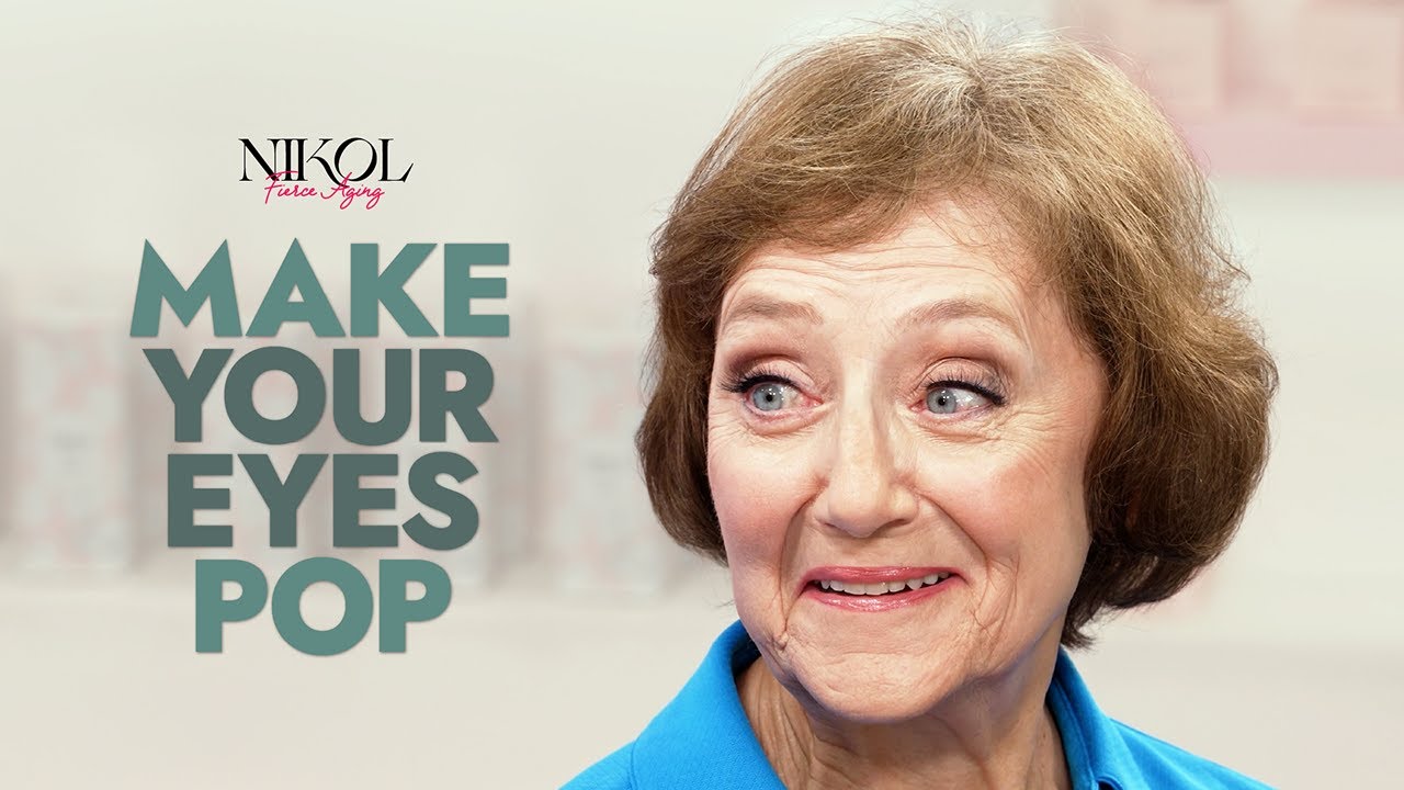 Nikol Johnson demonstrating how to make eyes pop for women over 70 using navy eyeliner and the Rewrite The Rules palette