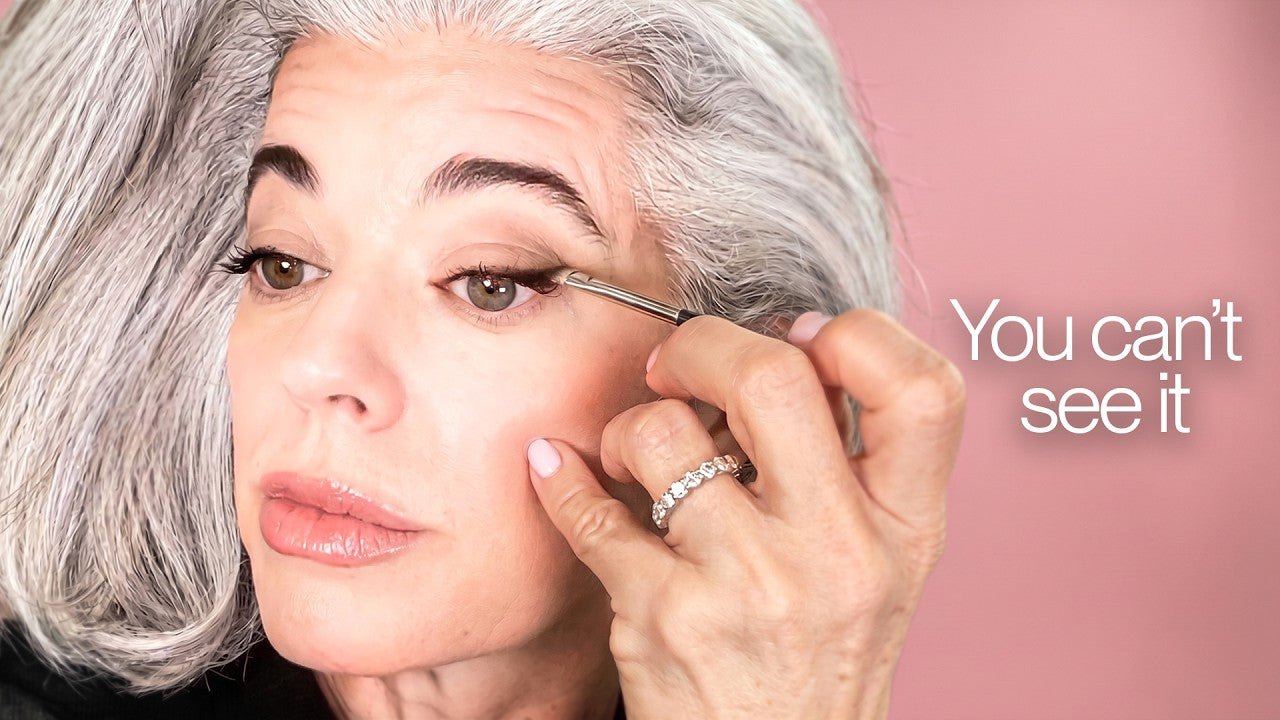 Nikol Johnson demonstrating the invisible eyeliner technique on a mature eye