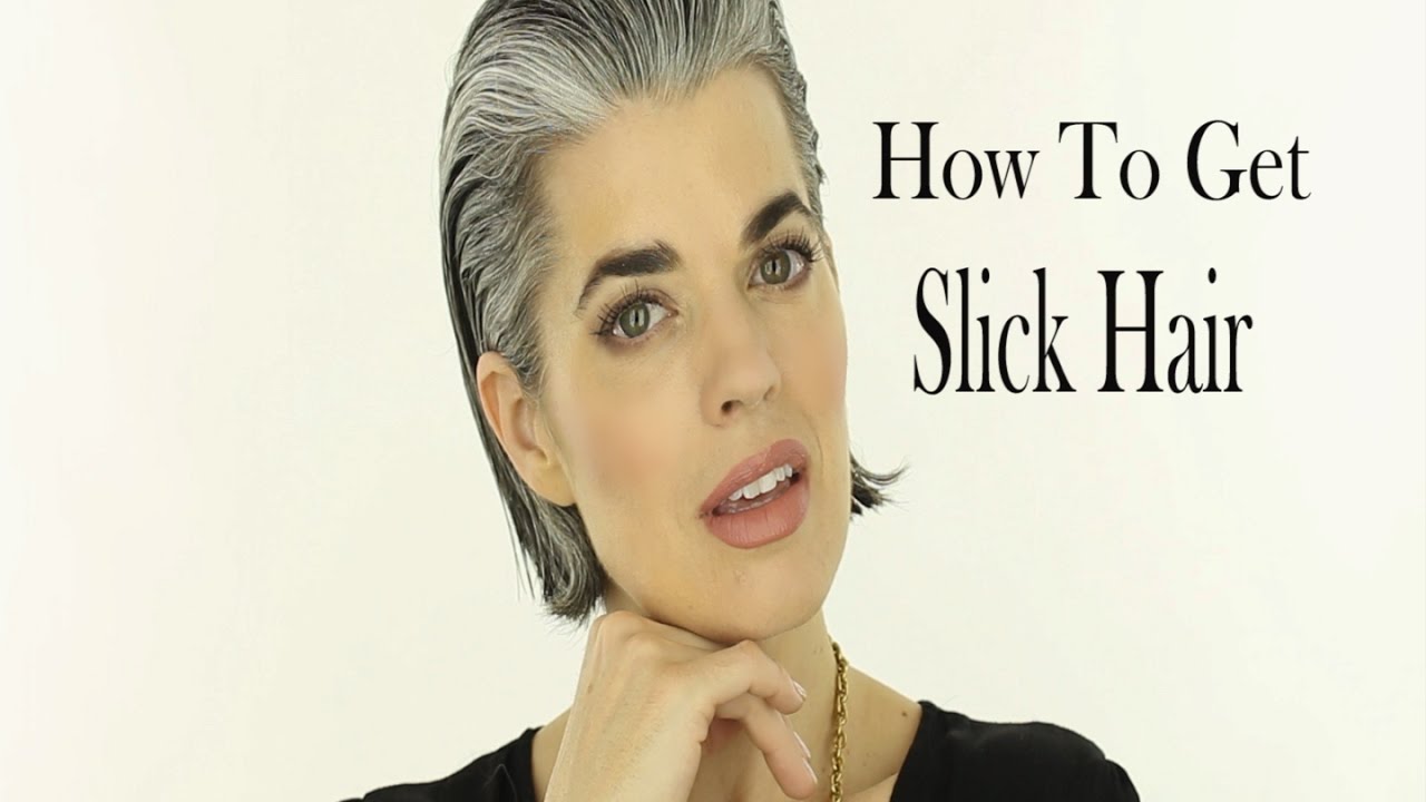 Slicked-back wet-look short bob on silver gray hair