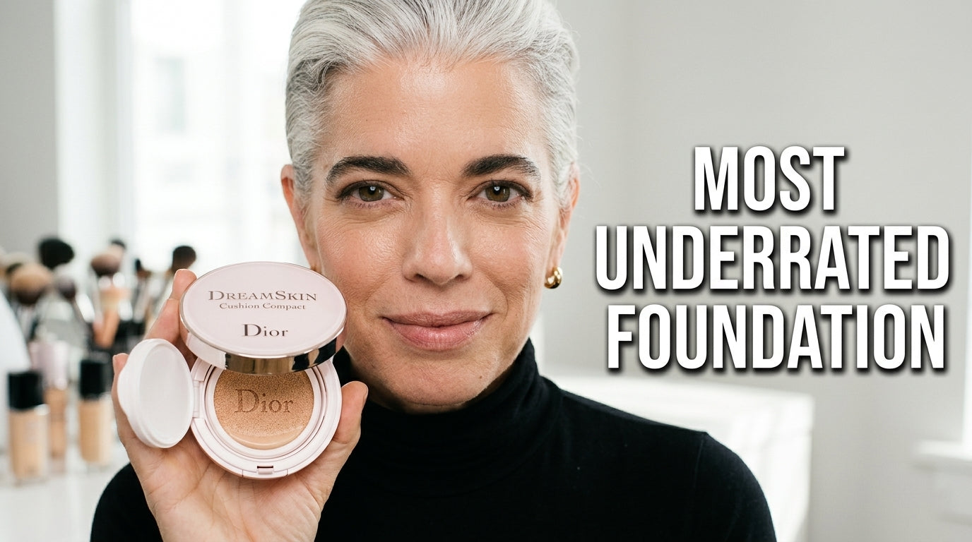 Woman with perfect skin holding foundation bottle.