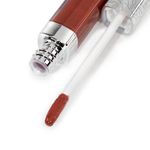 A close-up of Nikol Beauty’s Ignite Lip Gloss #176, featuring a silver-capped tube and wand coated in shimmery, high-shine reddish-brown gloss—ideal for adding sophisticated flair to any look.