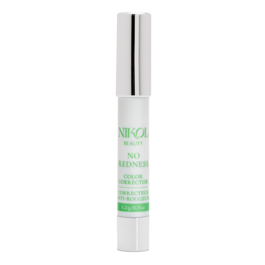 A white and silver tube of Nikol Beauty No Redness Color Corrector stands upright on a white background, with light green text emphasizing its ability to neutralize redness for a flawless complexion.