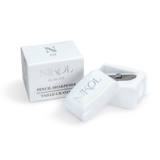 The Nikol Beauty Pencil Sharpener is a makeup bag essential, featuring a professional blade in an elegant box. Its simple design with silver text makes it perfect for maintaining your eyeliners and ensuring flawless application every time.