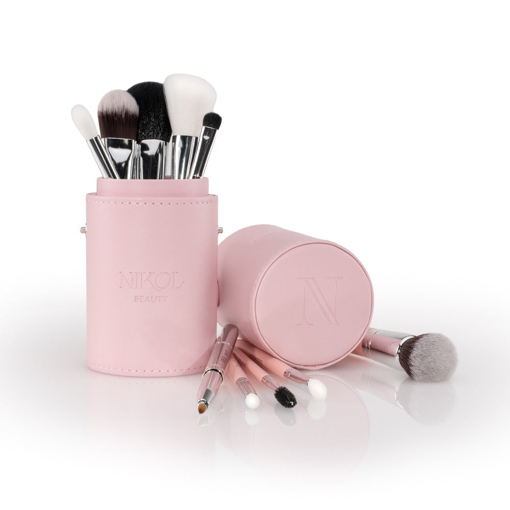 The Essential Makeup Brush Set in its blush pink NIKOL BEAUTY tube, with the lid and smaller brushes laid in front