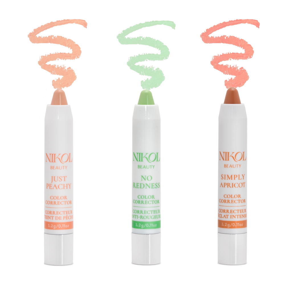 Three color corrector sticks from Nikol Beauty's Color Corrector Collection stand upright on a white background with spiral swatches above: Just Peachy (peach), No Redness (green), and Simply Apricot (apricot) for targeted color correction.