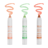 Three color corrector sticks from Nikol Beauty's Color Corrector Collection stand upright on a white background with spiral swatches above: Just Peachy (peach), No Redness (green), and Simply Apricot (apricot) for targeted color correction.