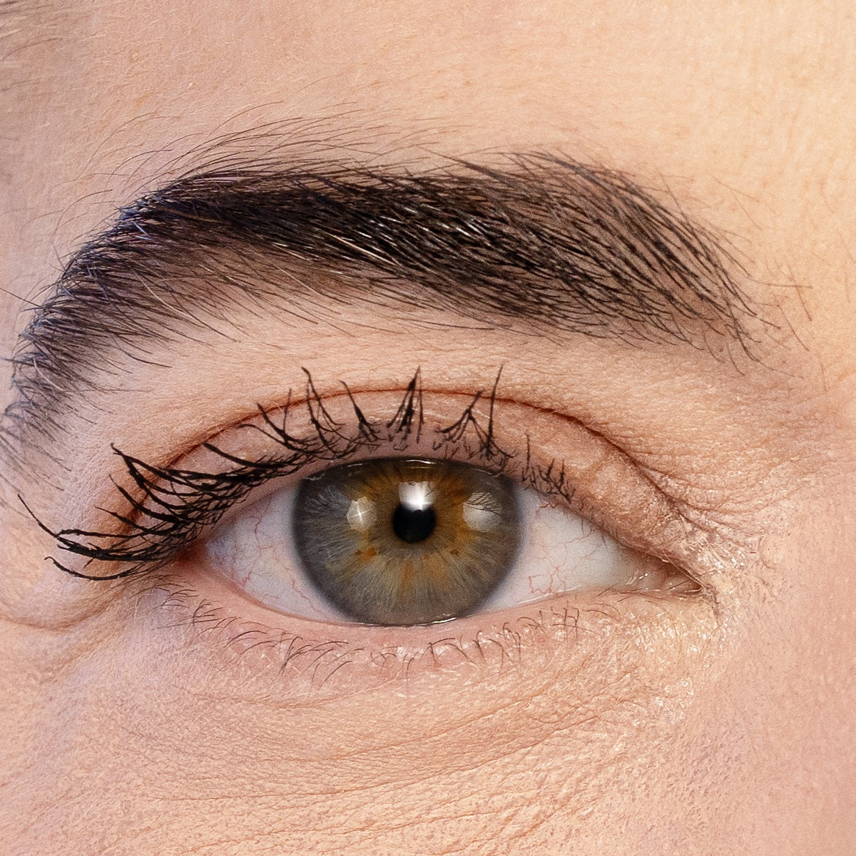 Close-up of a mature eye with VOLUME UP Mascara on the upper lashes