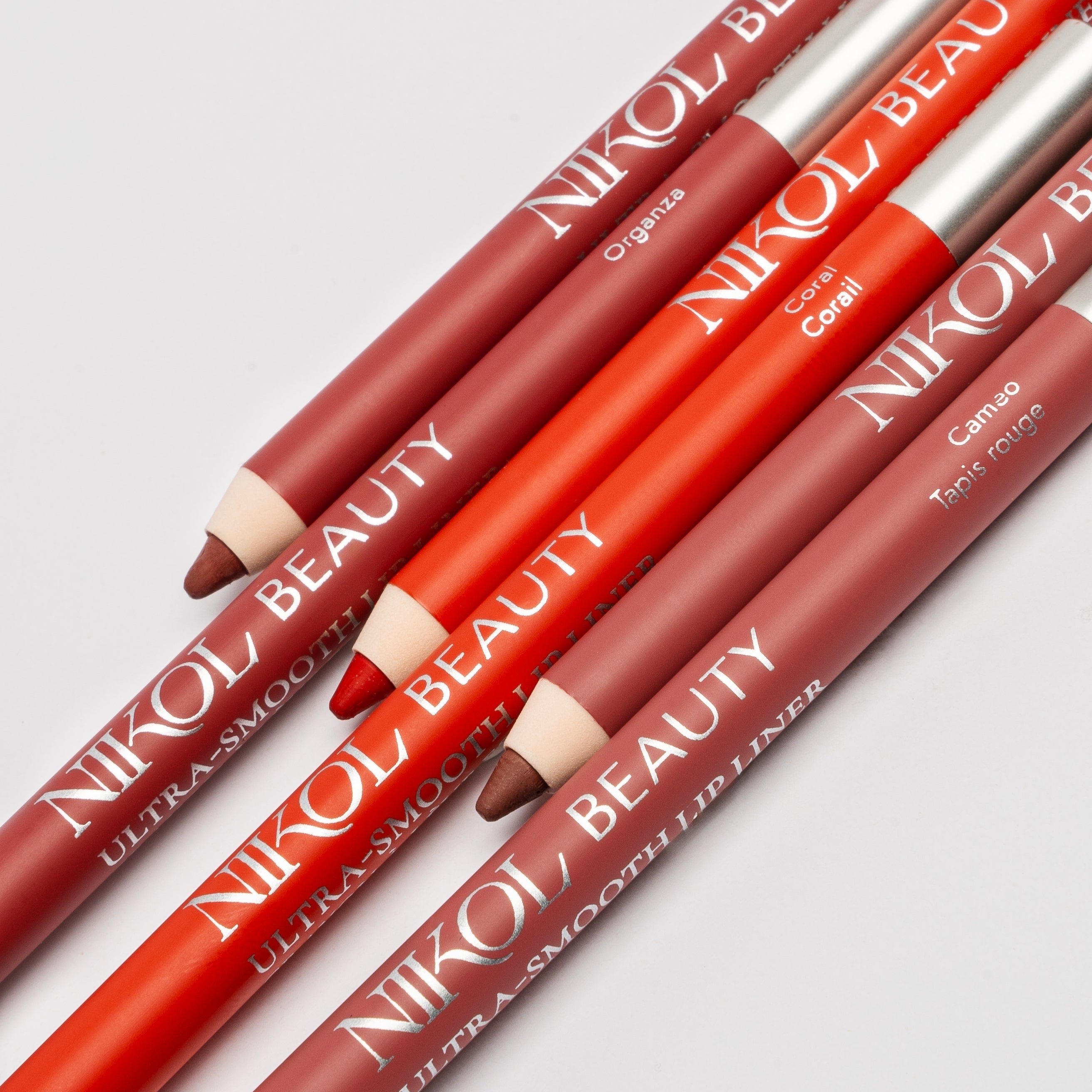 WaterProof Lip Liner pencils in Organza, Coral and Cameo laid side by side with sharpened tips