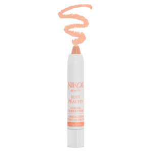 Nikol Beauty Just Peachy Color Corrector, a peach-toned crayon (3.2g/0.11oz), stands upright with a peach swirl above its tip—ideal as an undereye brightener to correct dark circles for a refreshed look.