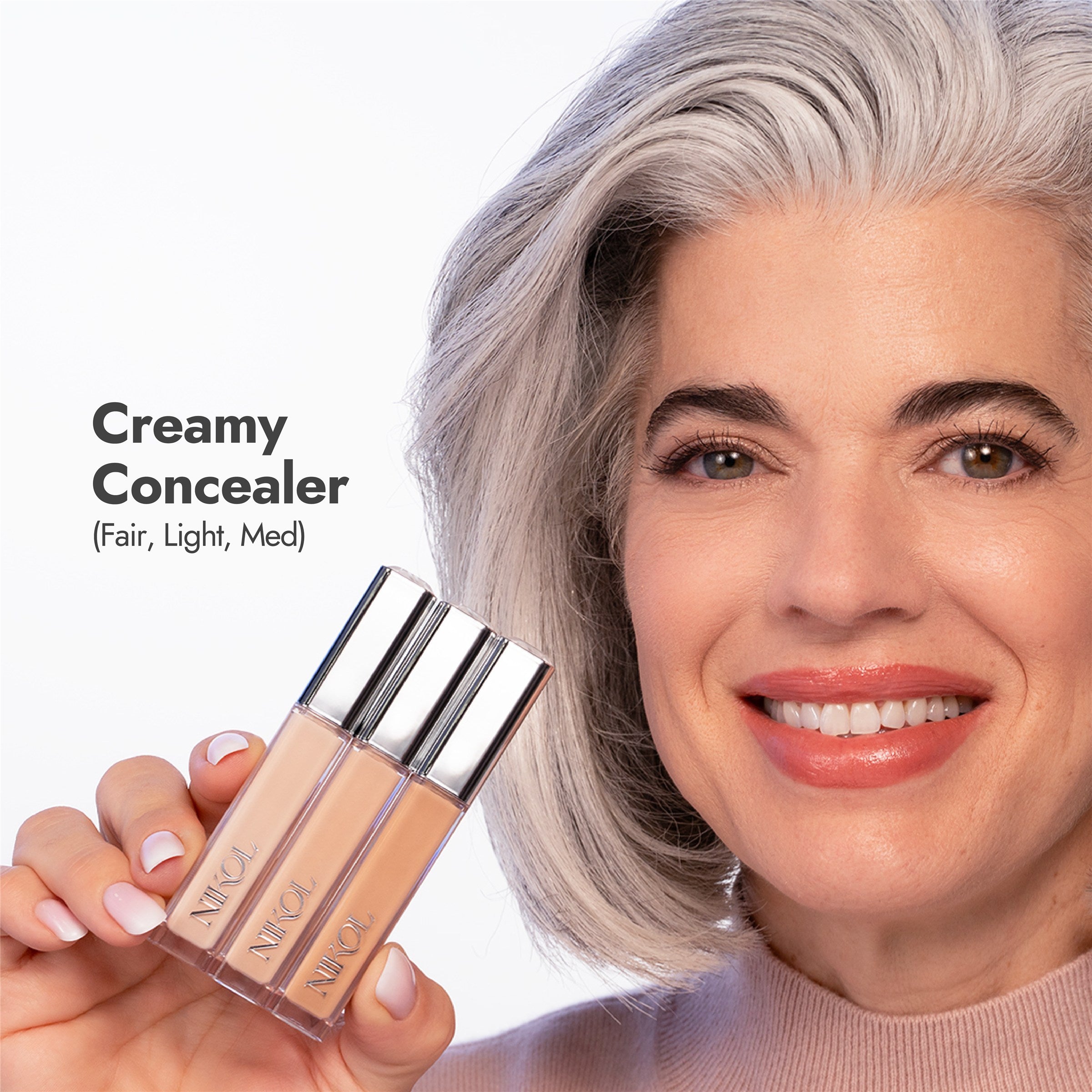 Nikol holding the three Creamy Concealer shades (words version)