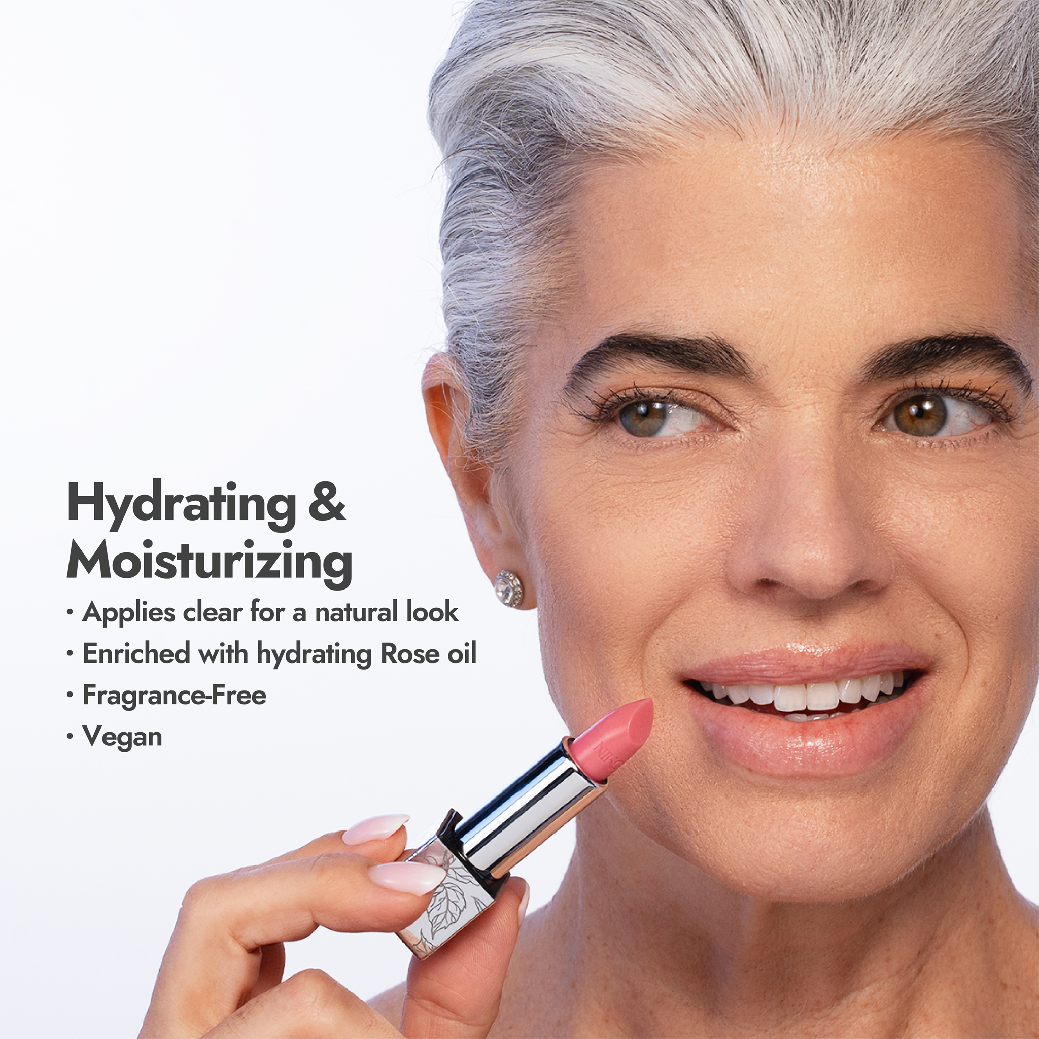 Nikol applying Rose Lip Balm: hydrating and moisturizing, applies clear for a natural look, enriched with hydrating rose oil, fragrance-free, vegan