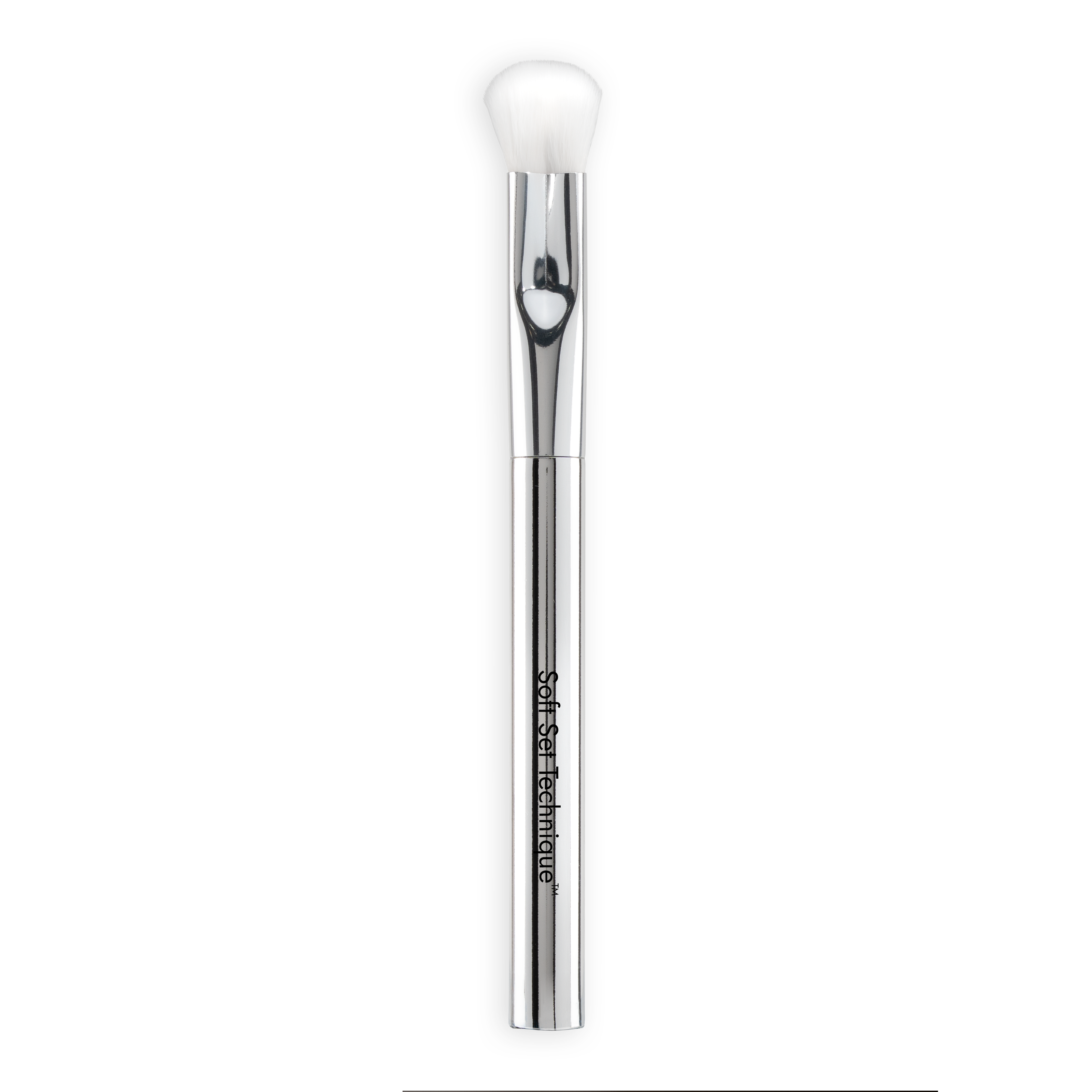 The Nikol Beauty SOFT SET TECHNIQUE™ BRUSH is a silver vegan makeup brush with a white, soft bristle head and "Softer Than Couture" on the handle, perfect for under-eye setting and shown on a white background.