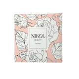 A square box with a pink background and white floral designs centers on a white rectangle displaying Gua Sha Stainless Steel by Nikol Beauty, emphasizing its lymphatic drainage benefits.